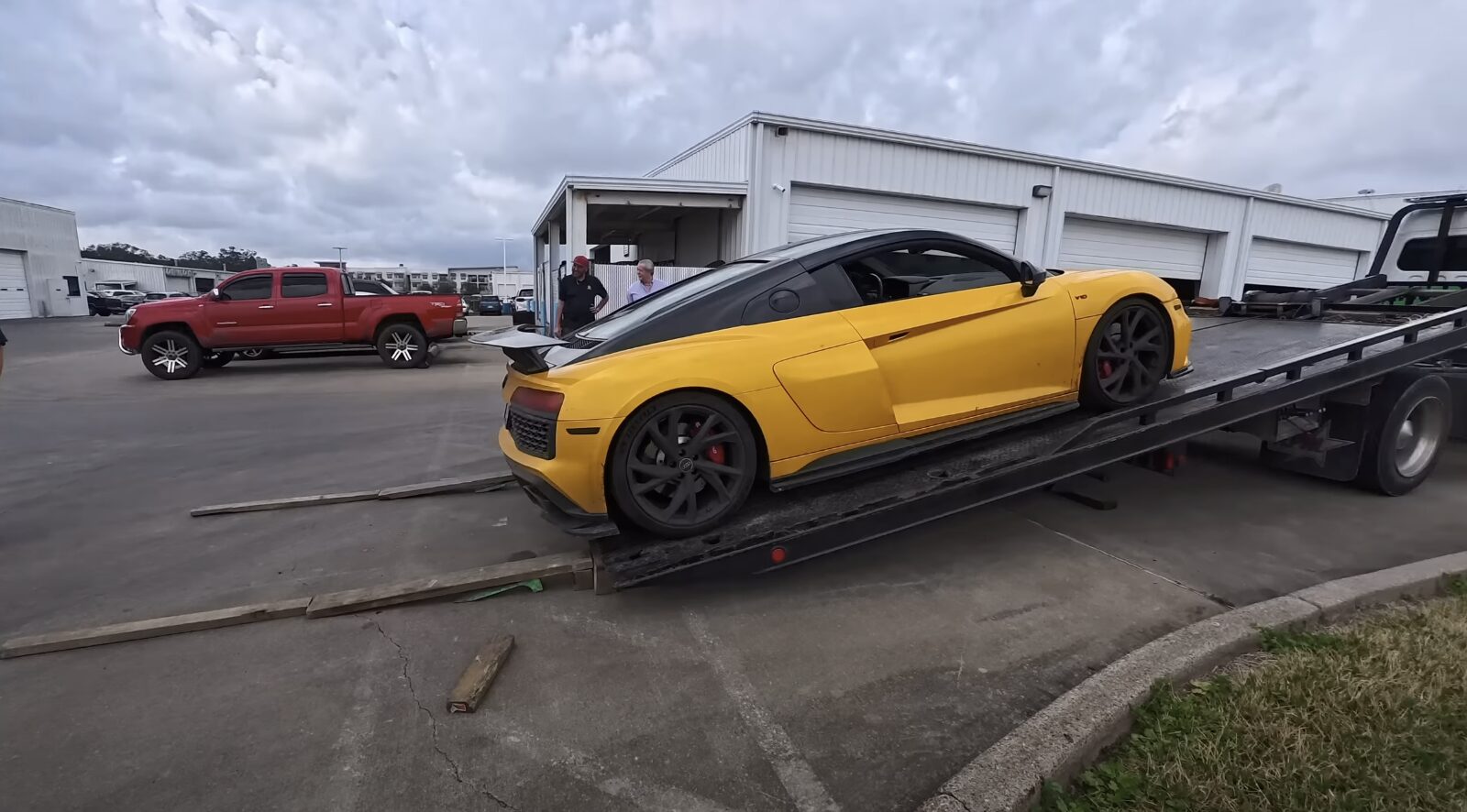 Luxury Vehicle Flatbed Towing - Professional Transport Service Professional luxury vehicle towing on flatbed truck